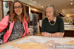 Charlotte Bill and Helen Kay selecting a 1914 map of Europe