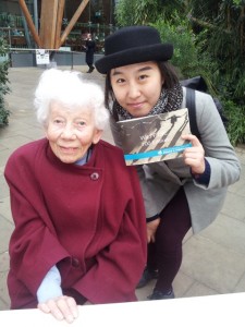 Rosalie Huzzard, founder of Sheffield WILPF poses with a 21-year old student from China at the WILPF 100th Anniversary exhibition in Sheffield Winter Gardens